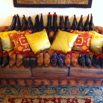 Mark Massinghams collection lounging on his leather Chesterfield