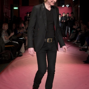 Sir Tom Baker finishing off his catwalk show at the 100 Club with a designers walk in his tonic patent Rochester boots!