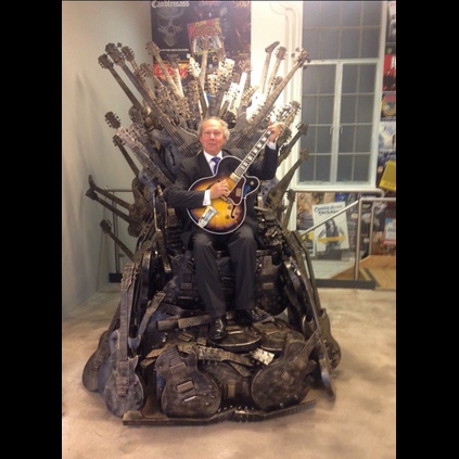 Alan Dublon sitting on a Gibson Game of Thrones Throne at the Gibson London HQ wearing his JWs!