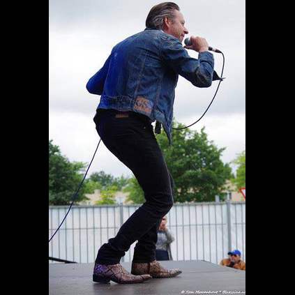 Marcel Duprix performing on stage with his band Mojo Man, in the Rochester Natural Snake boots!