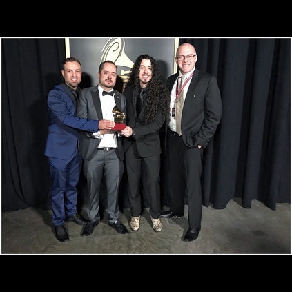 Ruben receiving his Latin Grammy in his Lynott boots